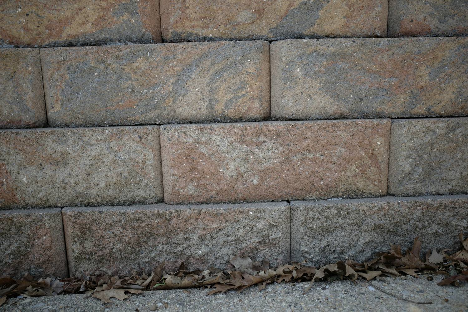 Close-up of stacked concrete block retaining wall units