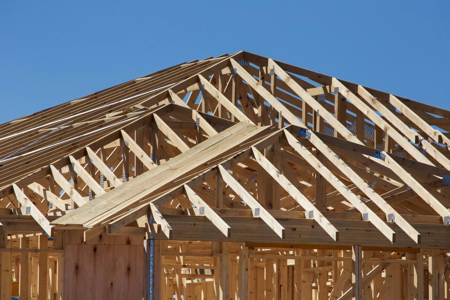 House under construction with wood framing exposed